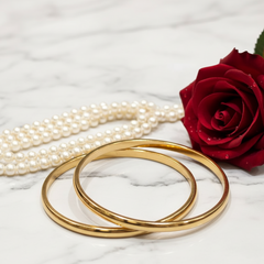 Classic Gold Bangles and Pearls on Velvet