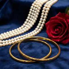 Classic Gold Bangles and Pearls on Velvet